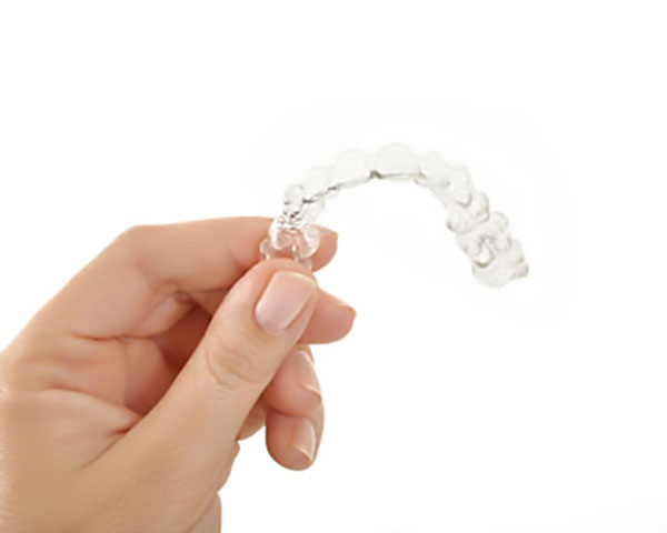Does Wearing Invisalign® Invisible Braces Hurt? - Palm Beach Dentistry  Delray Beach Florida
